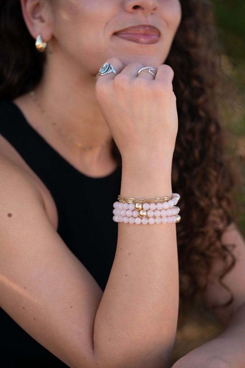 Rose Quartz bracelet stacked on a wrist