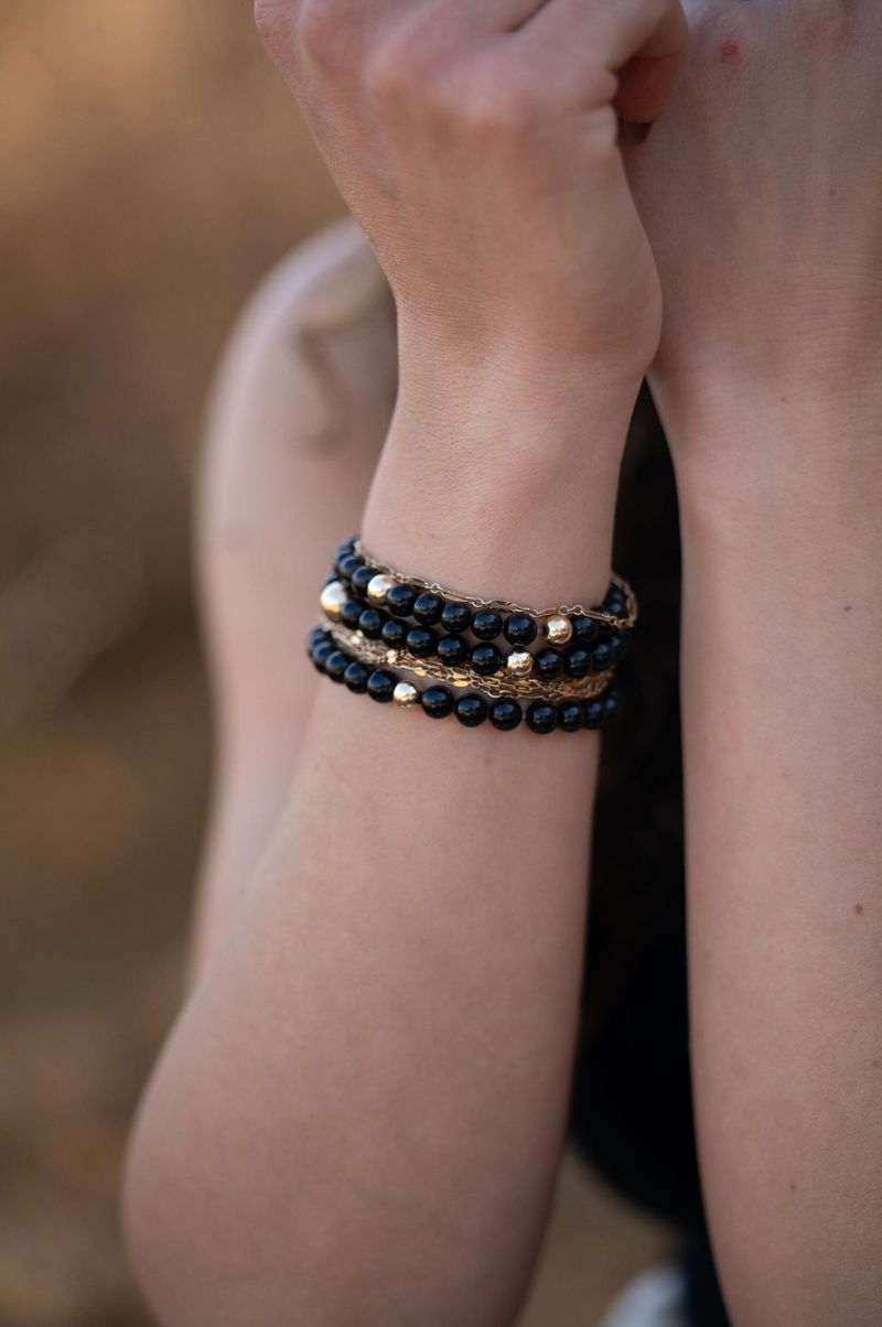 Black Onyx bracelet stacked on a wrist