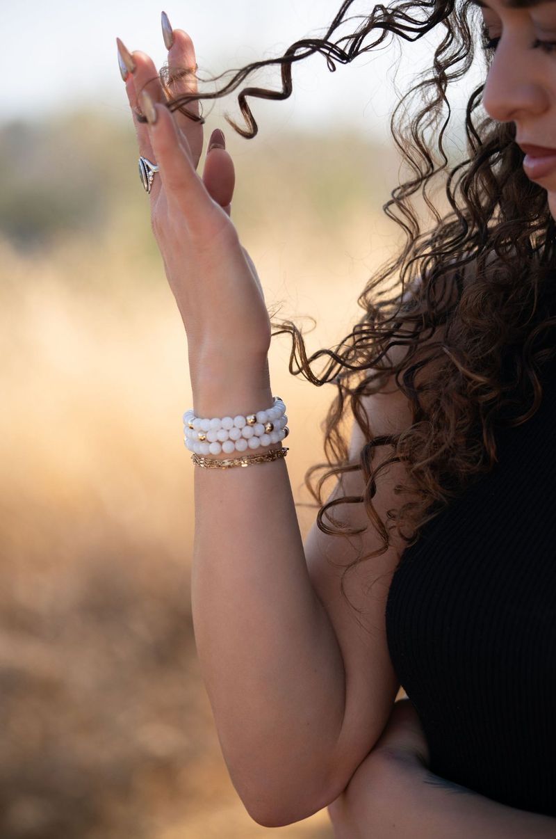 Moonstone bracelet stacked on a wrist