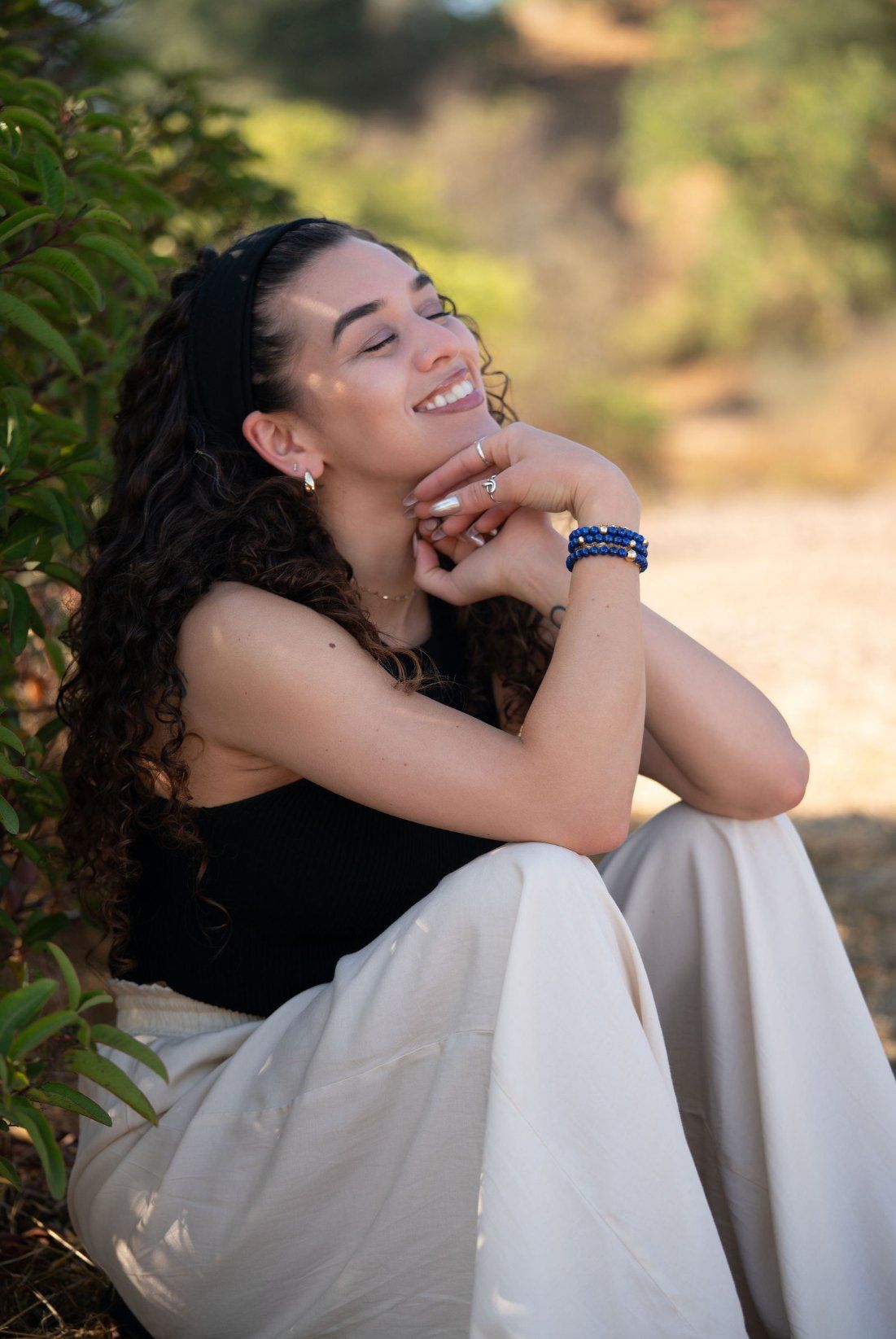 Char-Leen laughing with her chin resting on her hands